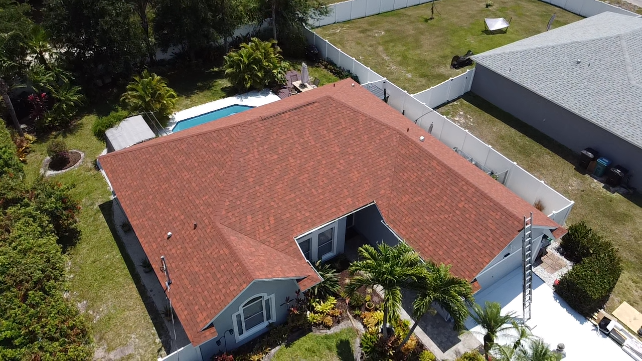 Aerial roof inspection view of a Port St. Lucie home