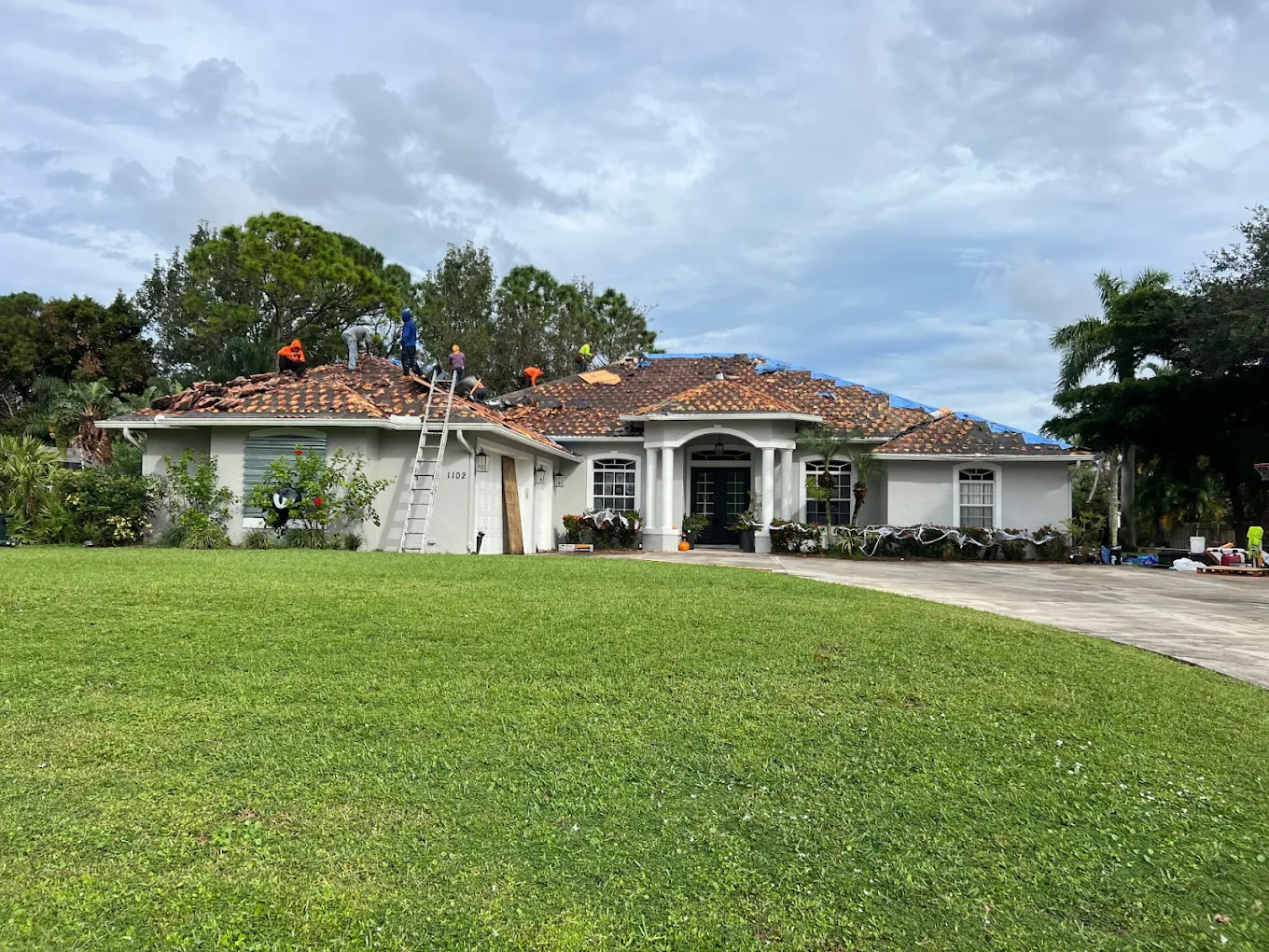 Storm-damaged tile roof tear-off in Port St. Lucie